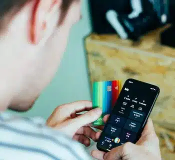 person holding black remote control