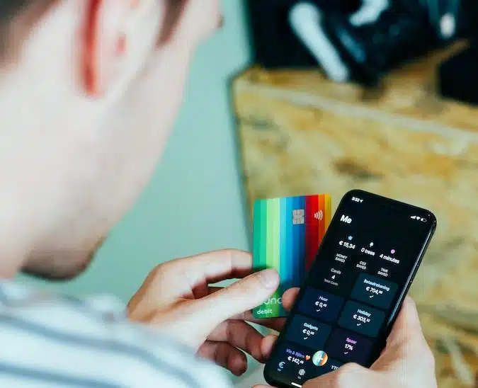 person holding black remote control